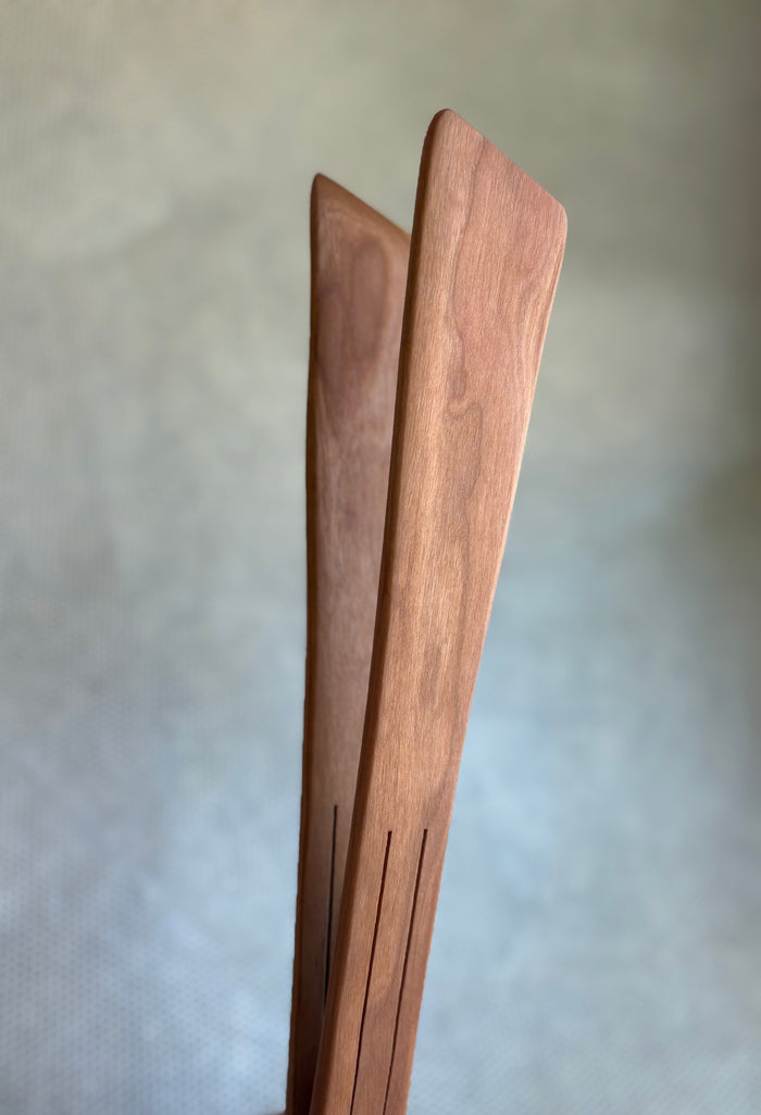 wooden serving tongs on light neutral background. Jonathan's Spoons.