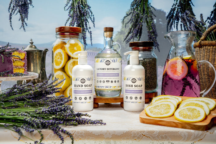 Rustic Strength - Cleaning Set | Lavender & Lemon surrounded by lavender buds, sliced lemons, a pitcher of lavender lemonade and a lavender frosted lemon pound cake.