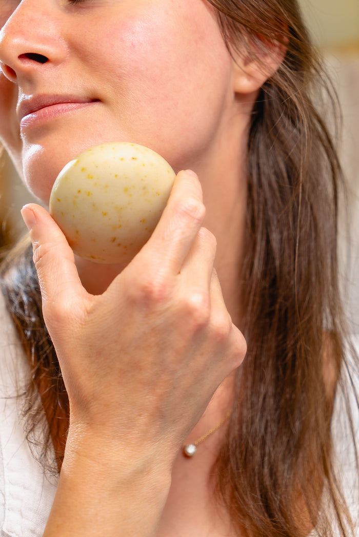 Rustic Strength, Nourish, 2.5oz Face Bar, Calendula Calm being used on face
