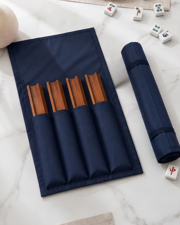 Dark blue mahjong rack cover with wooden slot bars and elastic pockets; rolled cover
