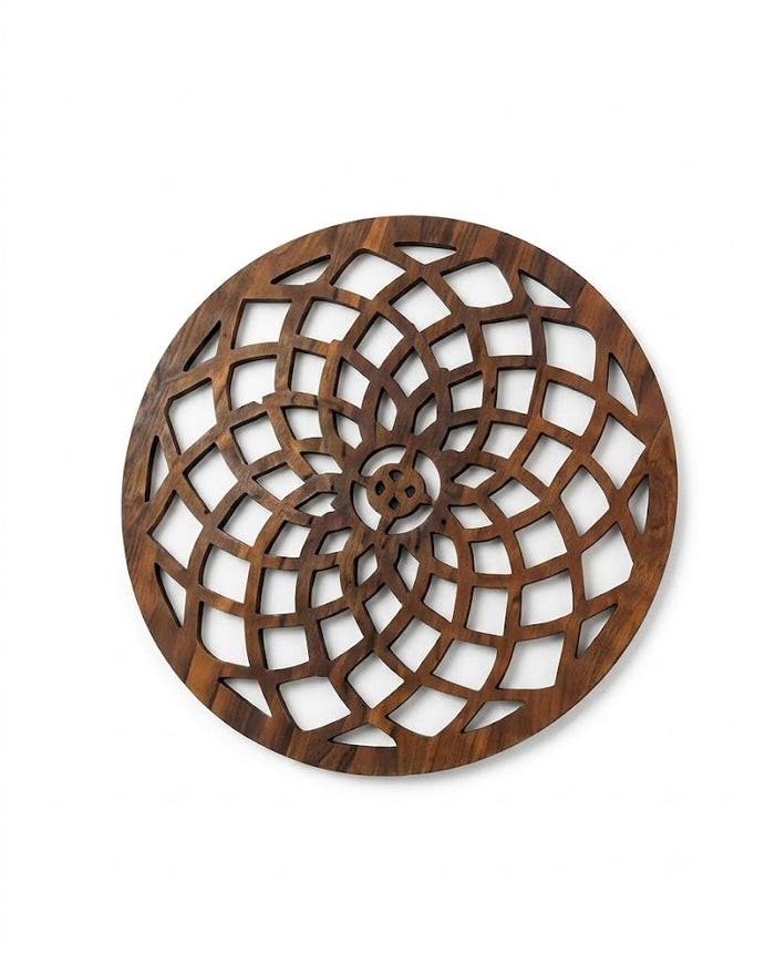 Round wooden pot stand trivet with carved spiral floral lattice in light brown