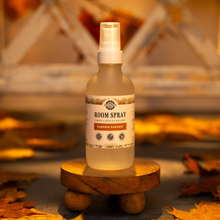 Rustic Strength, 4oz, Glass with spray top, Pumpkin Harvest with warm lighting surrounded by fall leaves